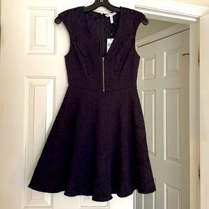 Short dress with zip in front, homecoming style. Navy and black, BCBG dress